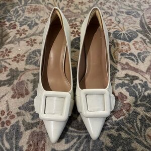 Women’s white pumps